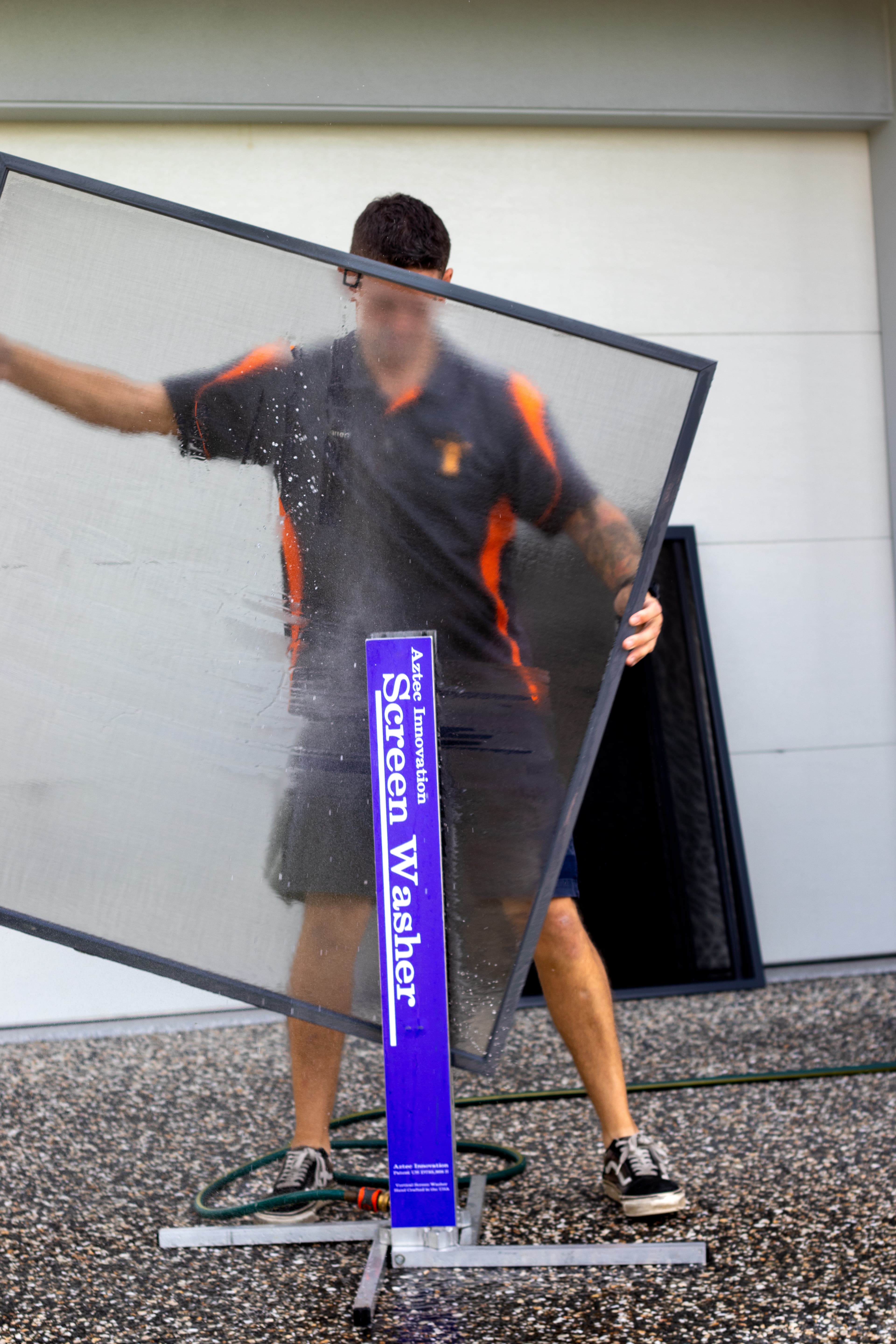Fly screen being cleaned professionally Brisbane